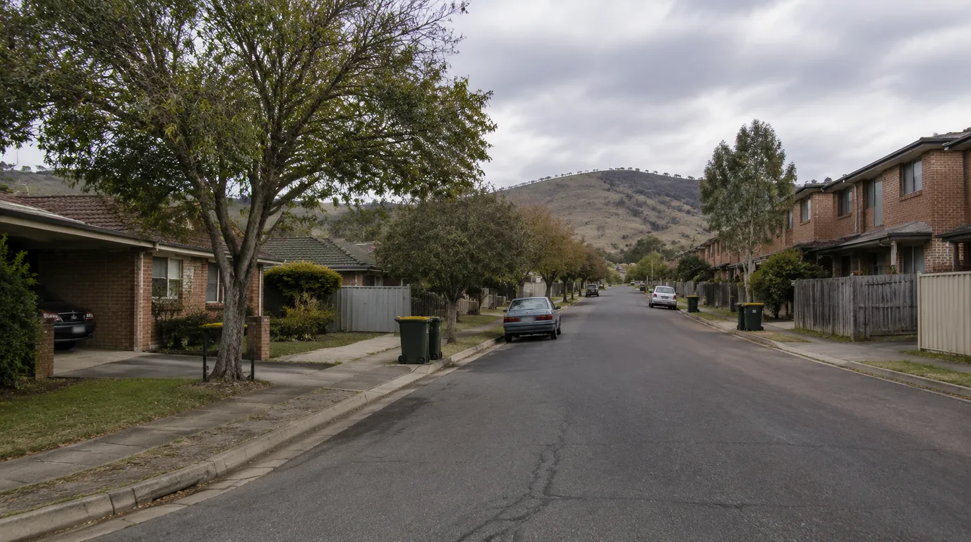A Karabar street in Queanbeyan New South Wales with established brick houses and townhouses below the slope of Mount Jerrabomberra